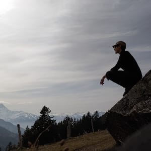 A picture of Ari Scheller hiking in the swiss apls